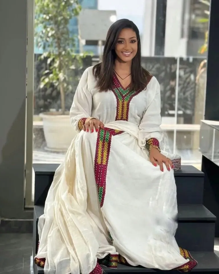 Timeless Beauty: Modern Menen Fabric Adorns Habesha Kemis